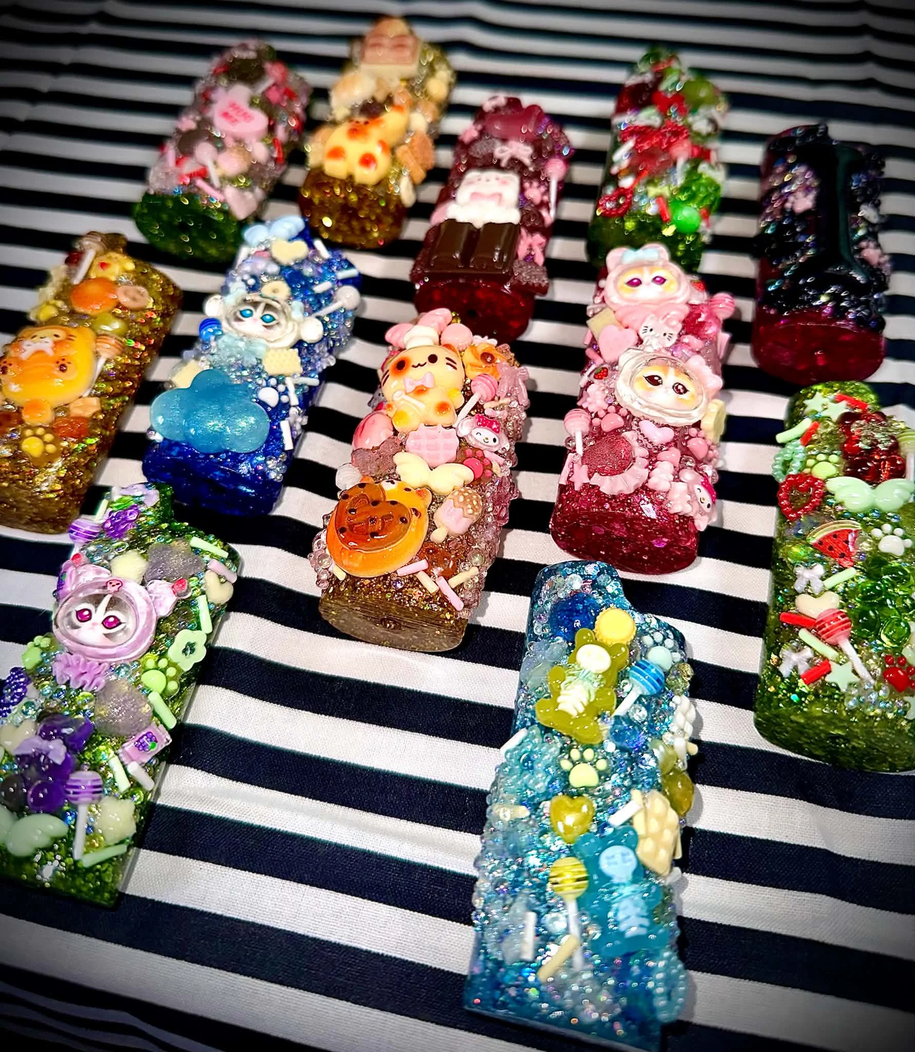 A colourful collection of handmade custom lighter cases
