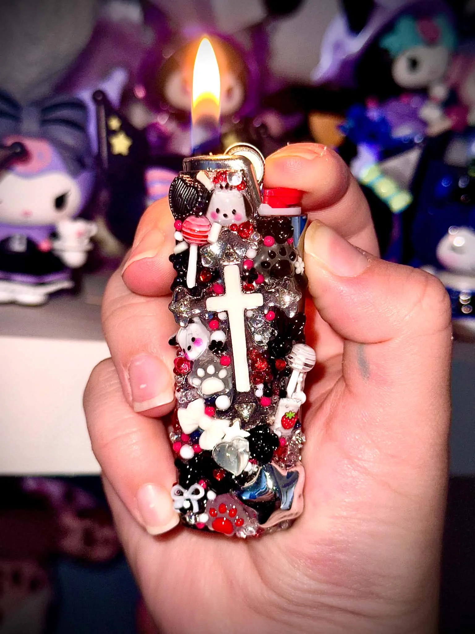 Black and silver handmade lighter accessory with a cross charm and paw prints