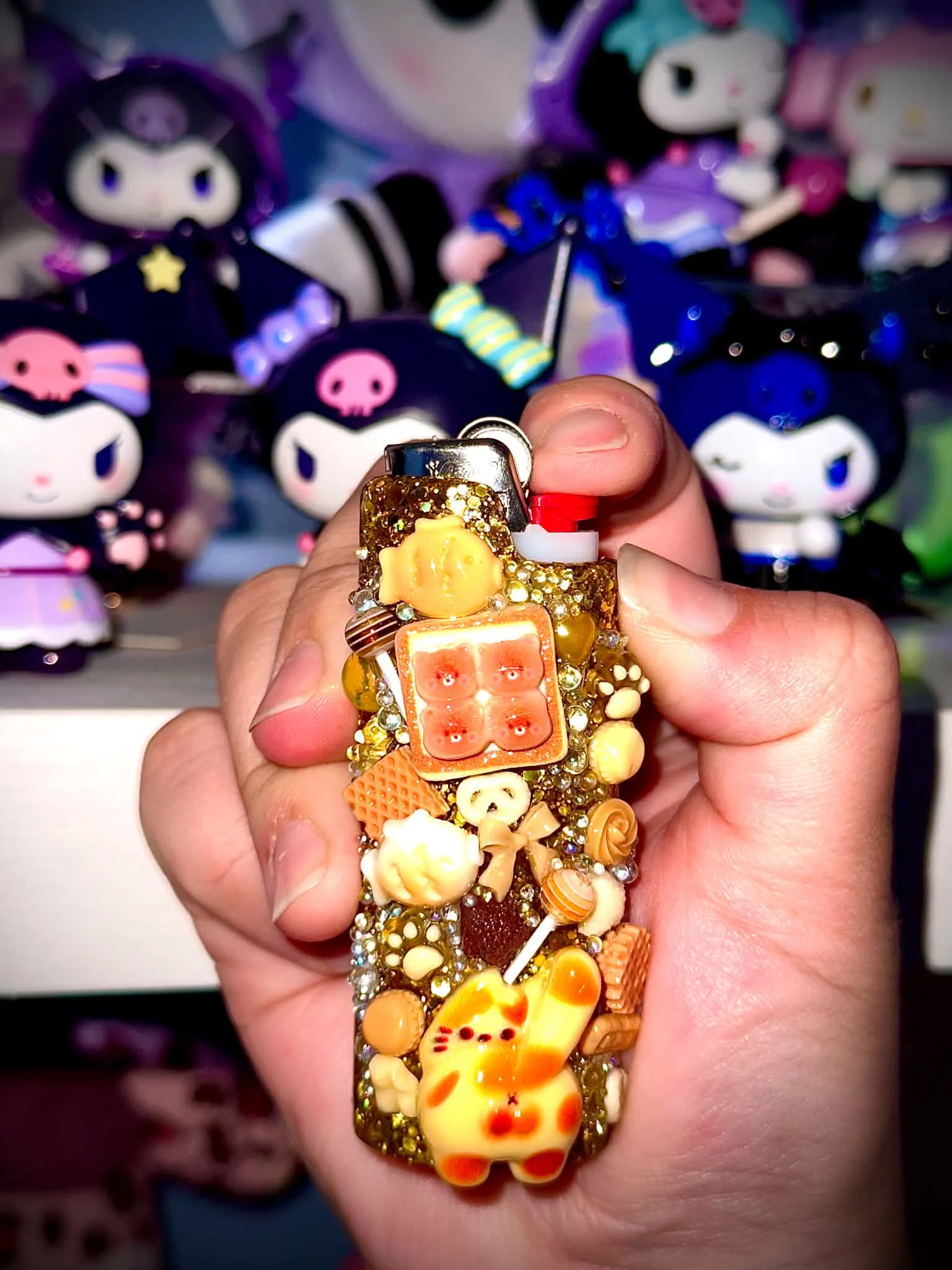 Golden custom lighter case covered in tiny charms