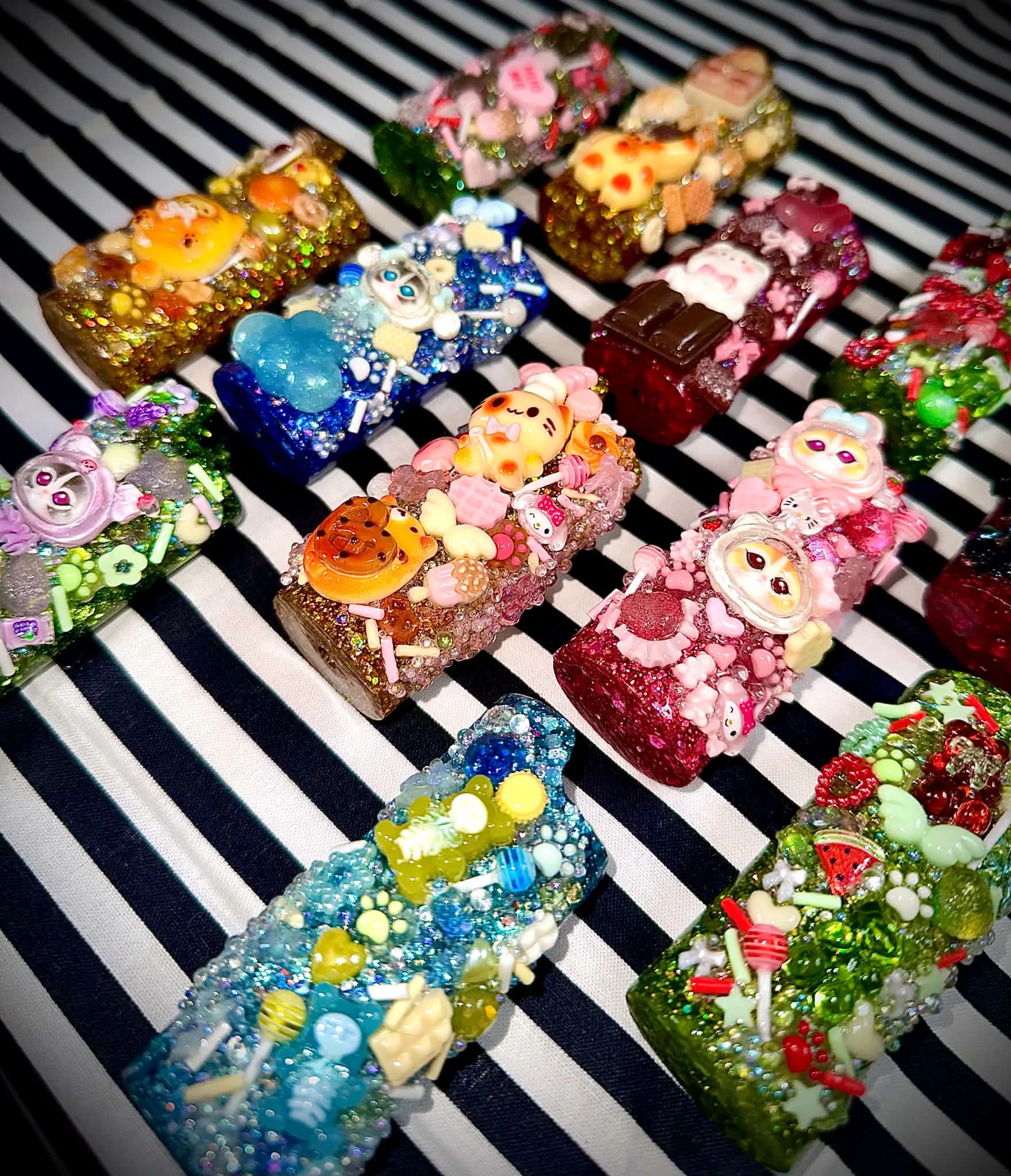 A colourful collection of handmade custom lighter cases and charm accessories